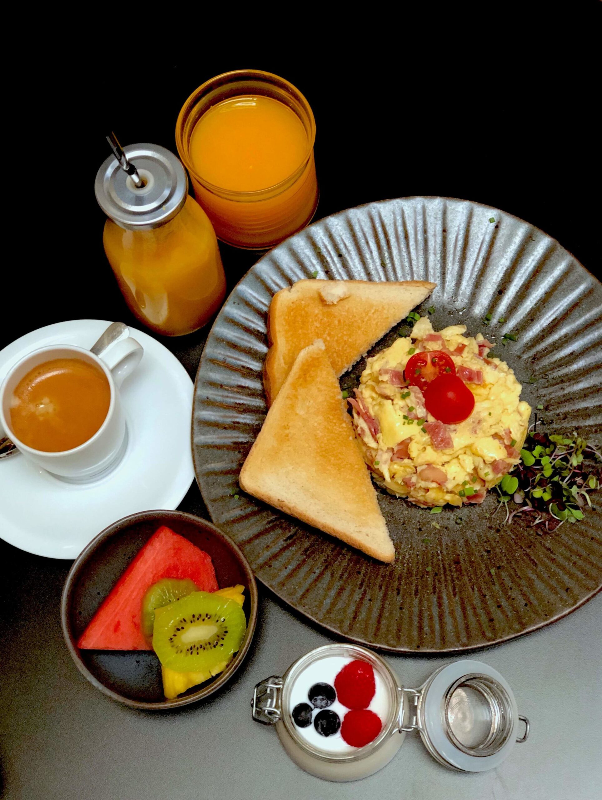 Breakfast at the hotel. Orangejuice, coffee, eggs, yoghurt and fresh fruits. 