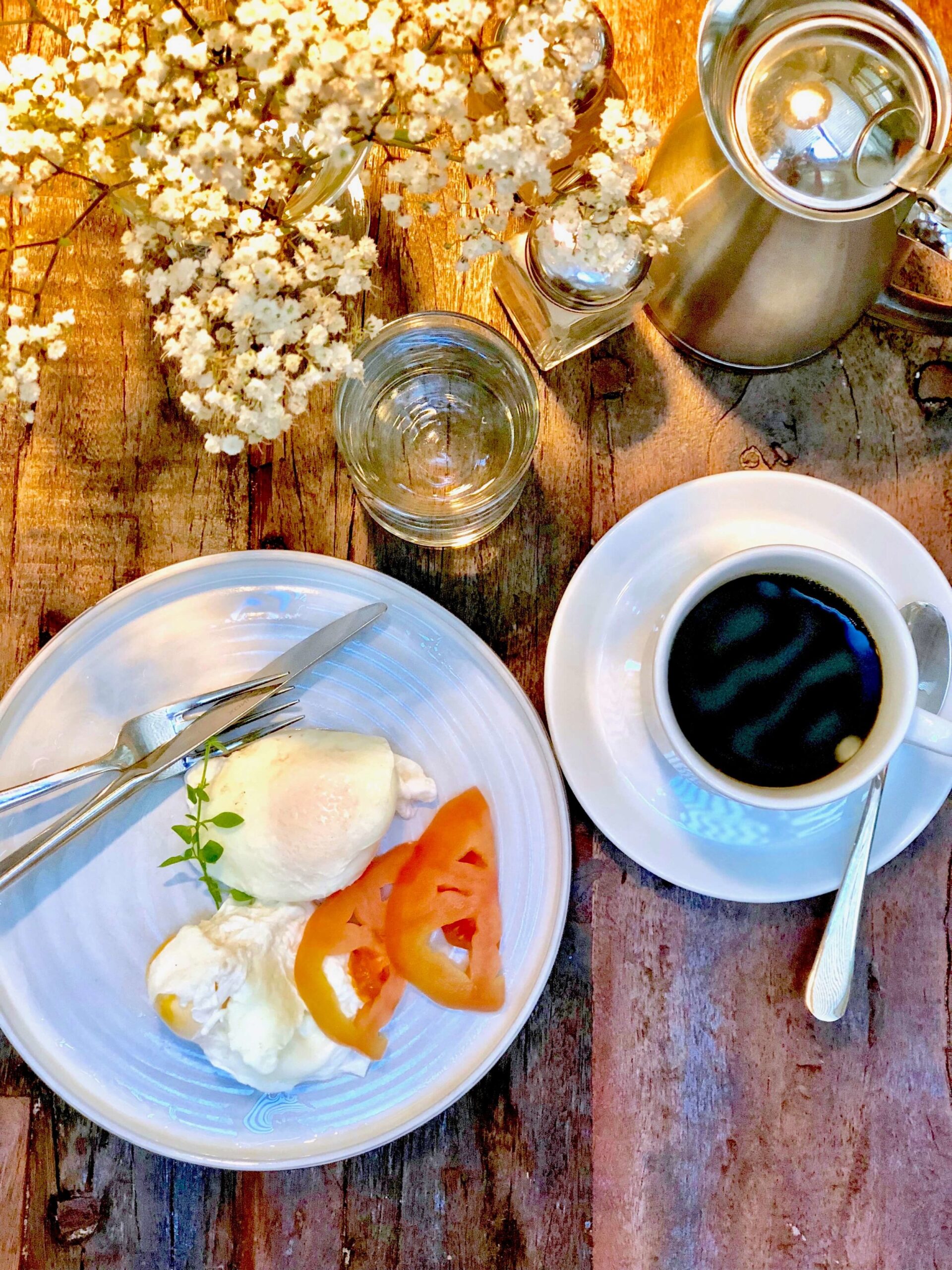 Breakfast with egg, tomatoes and coffee at Pulitzer Barcelona. 