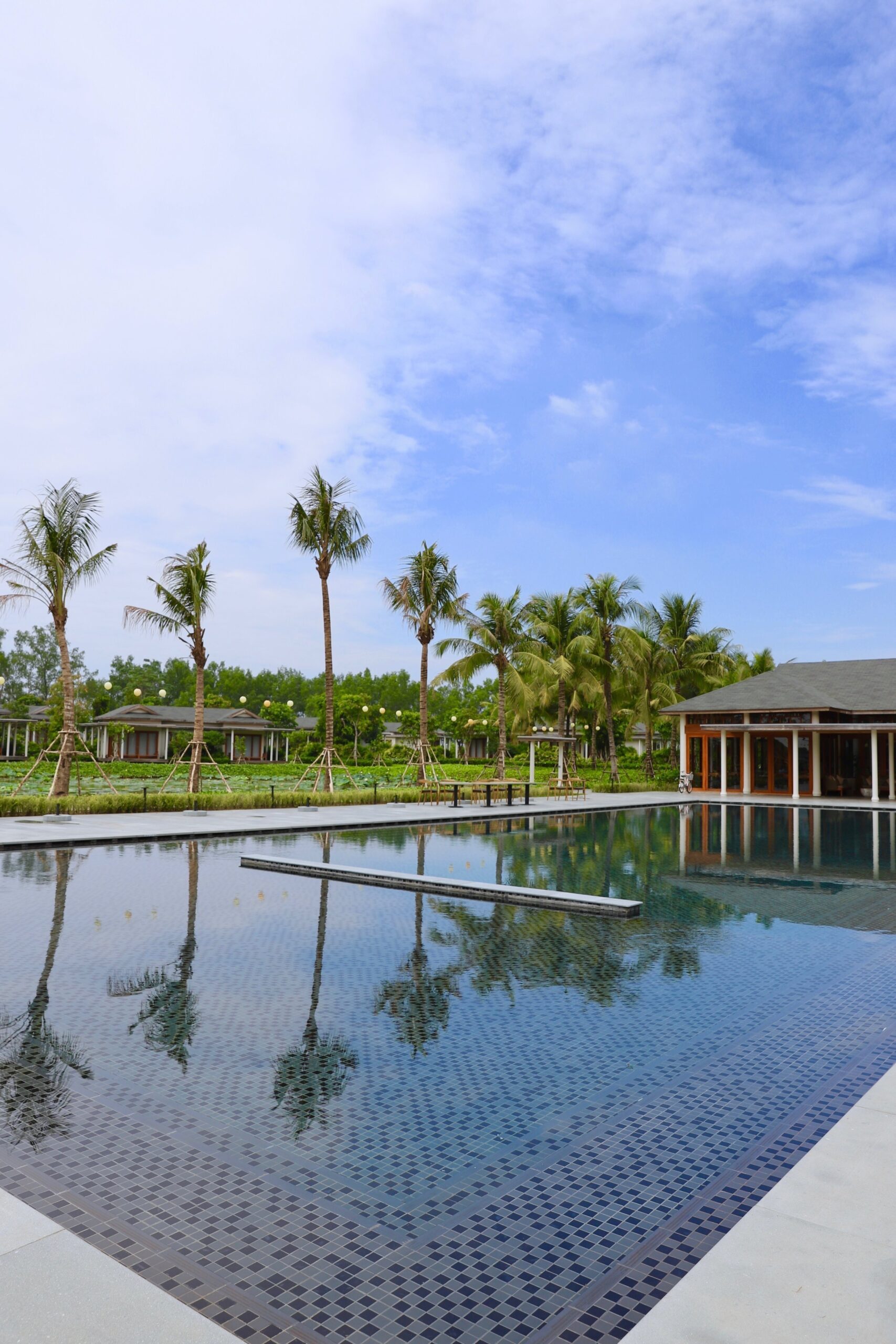 The pool and the garden at the hotel in the Mekong Delta. 