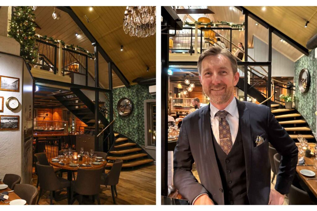 Interiør fra Becks Brasserie & Bar Osebro med daglig leder foran trappen i den lune og elegante restauranten