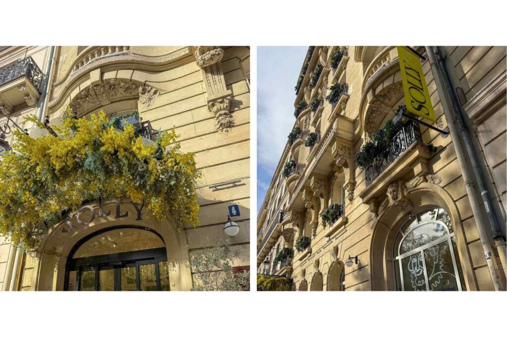 Fasade Solly Hotel ved Marais i Paris. Blomster og balkonger. 
